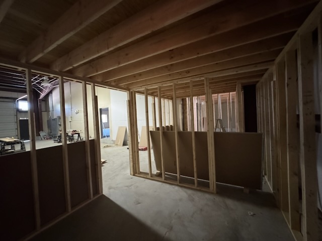 Bay 2 interior with the office walls framed, looking toward the open bay door