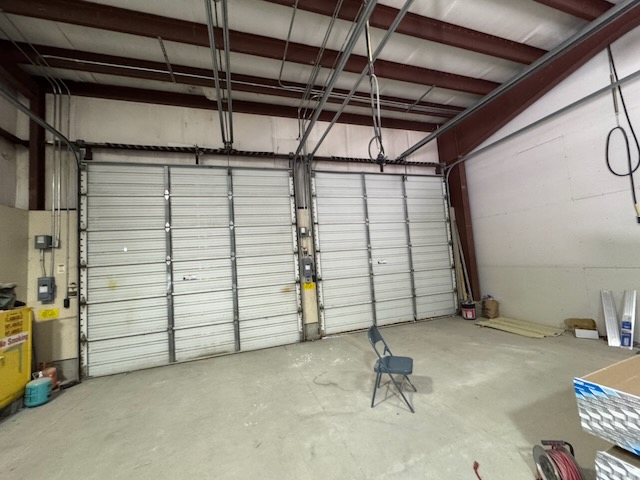 Bay 3 interior with both overhead doors installed and the steel frame overhead